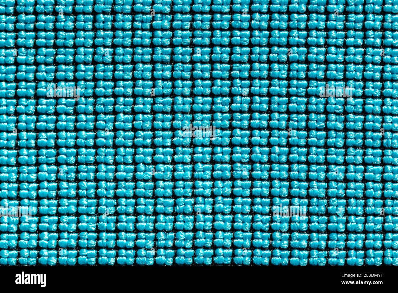 Abstraktes grünes und schwarzes KunststoffLeinen. Detail der Leinwand Textil Material Textur und Hintergrund. Stockfoto