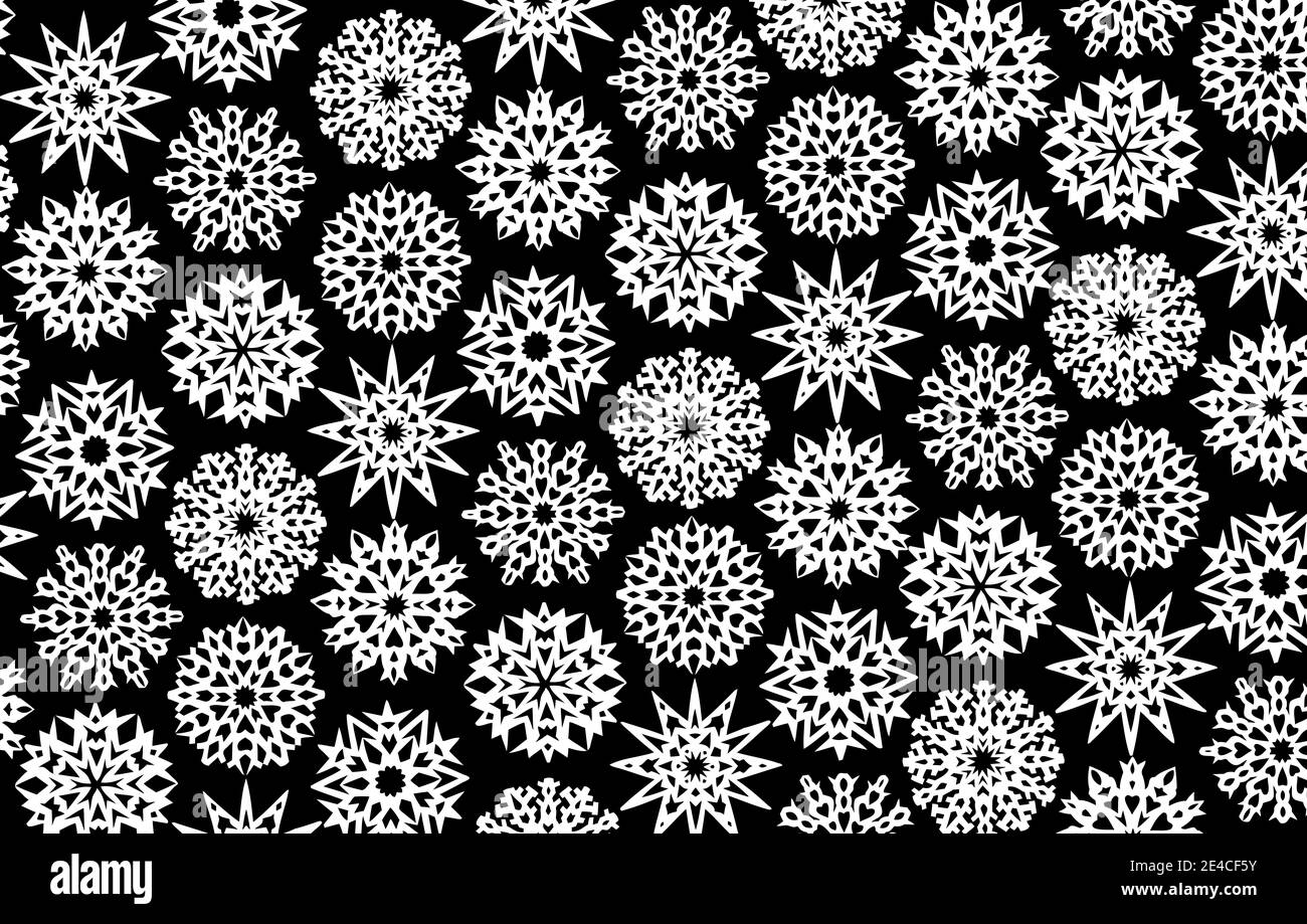 Verschiedene Schneeflocken als Papier in schwarz und weiß geschnitten Stockfoto
