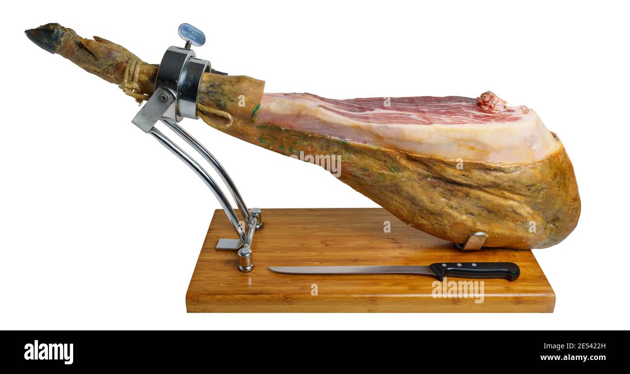 Schnitt von iberischem Schinken mit Eichelfütterung auf Metall- und Holzschinkenhalter, typisch spanische Feinschmeckerkost Stockfoto
