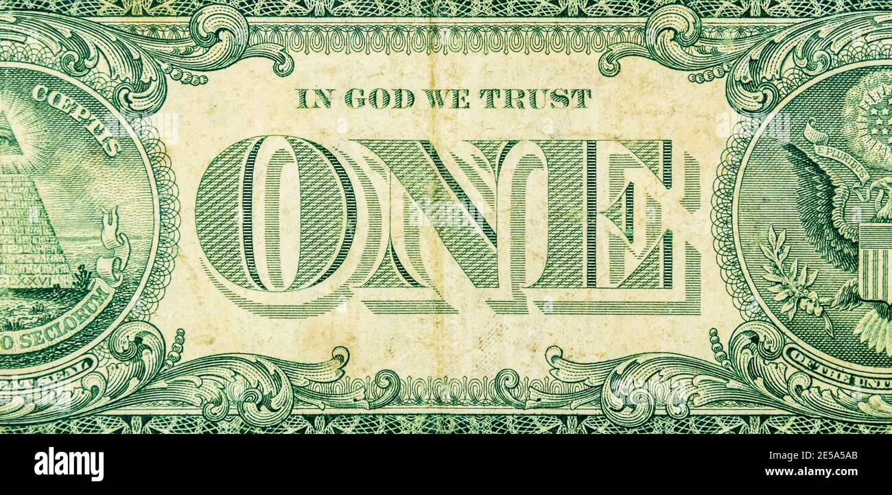 "In Gott vertrauen wir" auf einen Dollar - den Beamten Motto der USA Stockfoto