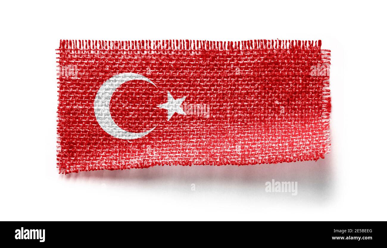 Türkei Flagge auf einem Stück Stoff auf einem weißen Hintergrund Stockfoto