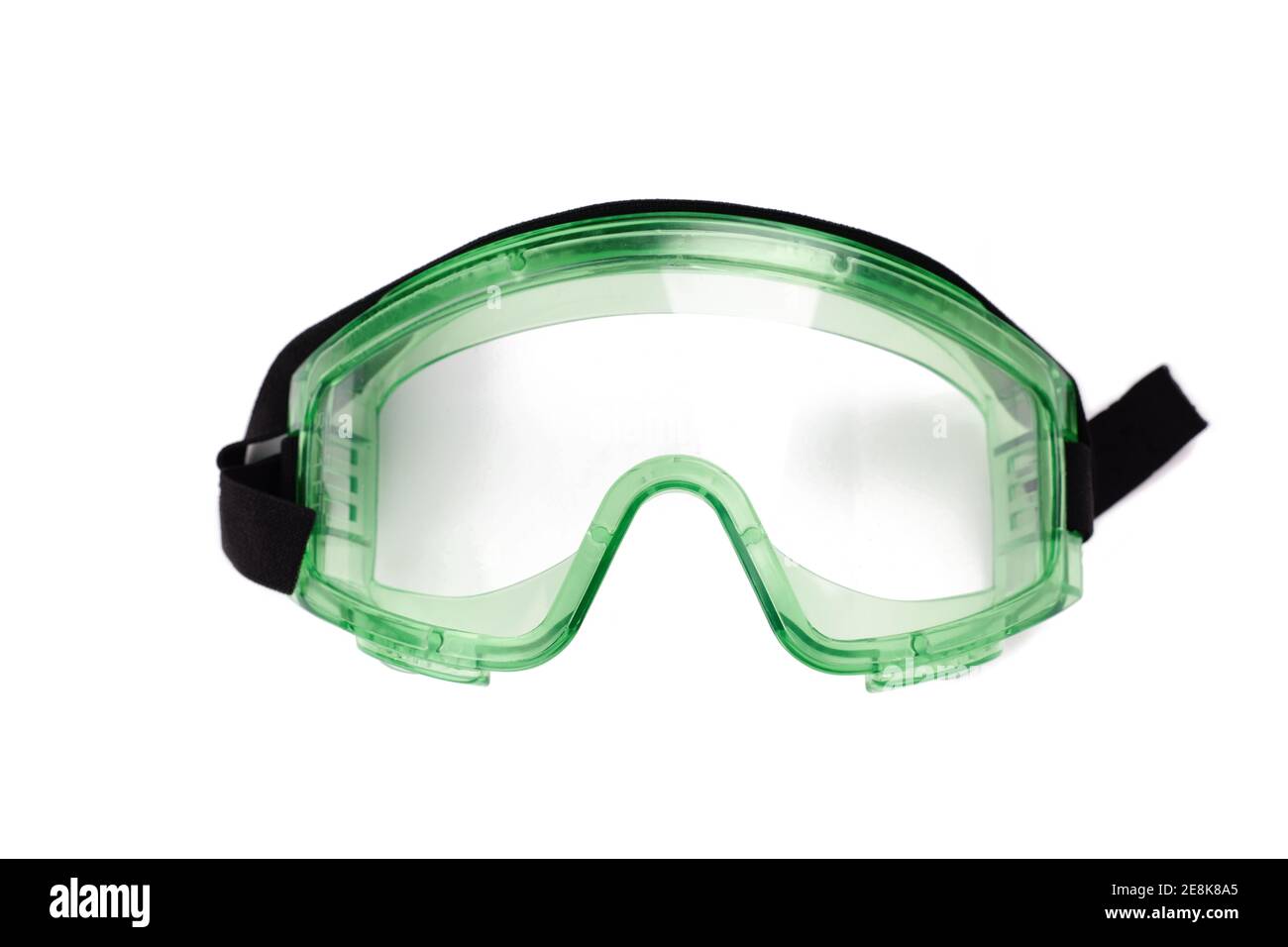 Grüne Schutzbrille isoliert auf weißem Hintergrund. Industrielle Schutzkleidung Stockfoto