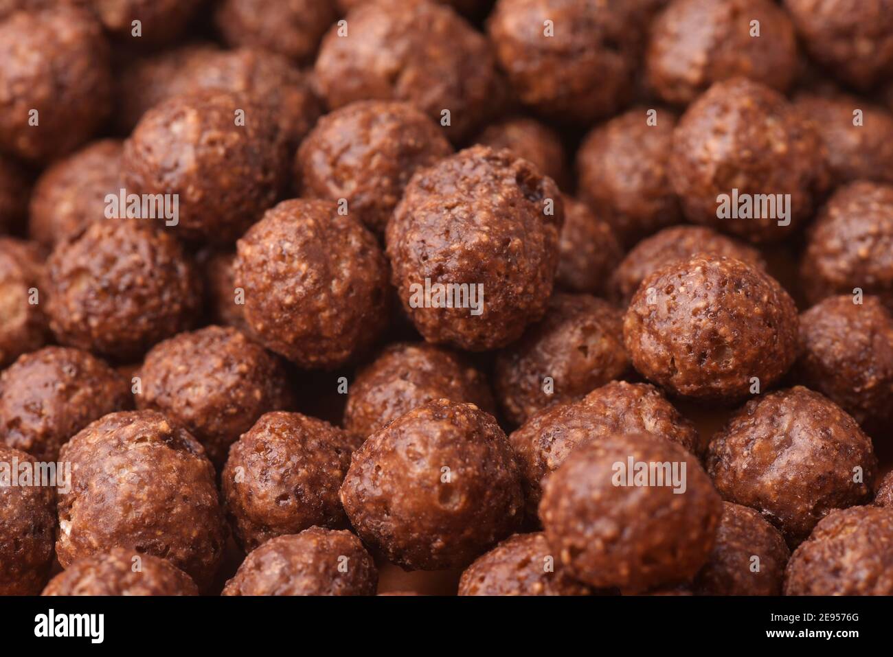 Nahaufnahme der Schokolade Getreidekugeln Hintergrund Stockfoto