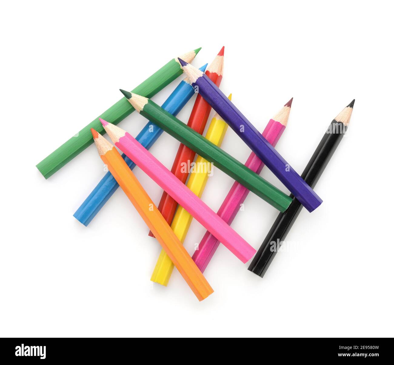 Draufsicht auf bunte Bleistifte auf Weiß isoliert Stockfoto