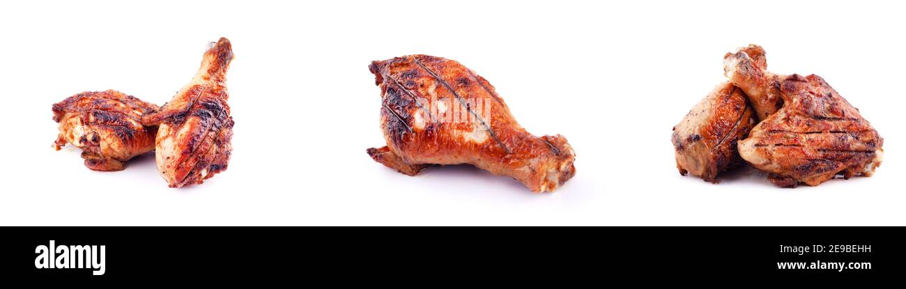 Gegrillte Hähnchenbeine auf weißem Hintergrund. Stockfoto