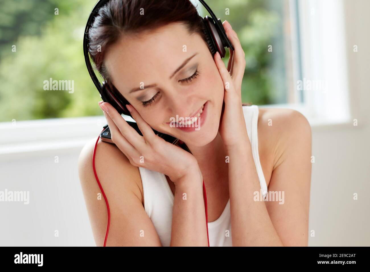Fun Mädchen hören Musik Stockfoto