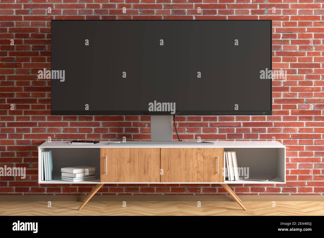 Der Breitbildschirm des Fernsehers stand in der Nähe einer Ziegelwand. Vorderansicht Stockfoto