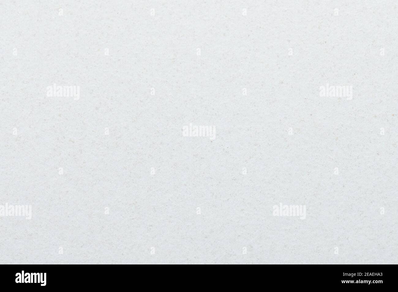 Makro mit grauem Papierhintergrund, veraltert, Nahaufnahme. Textur der leeren Oberfläche des weichen Papiers Stockfoto
