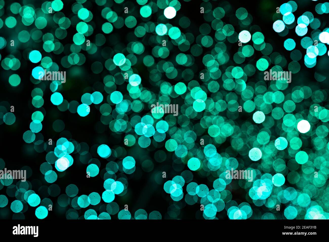 Türkis beleuchtet Bokeh als Hintergrund Stockfoto