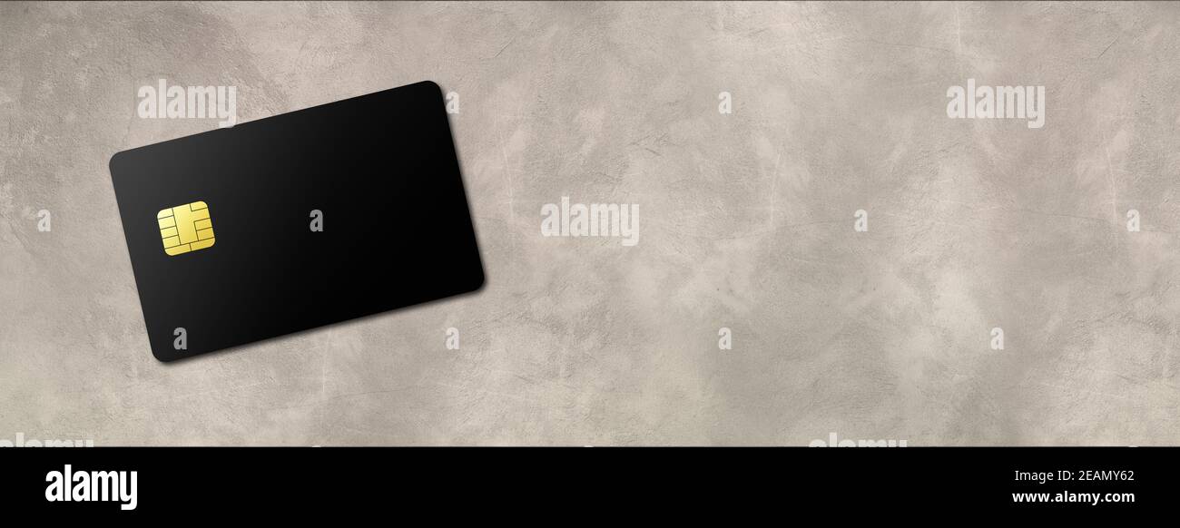 Schwarze Kreditkarte auf einem konkreten Hintergrund Stockfoto