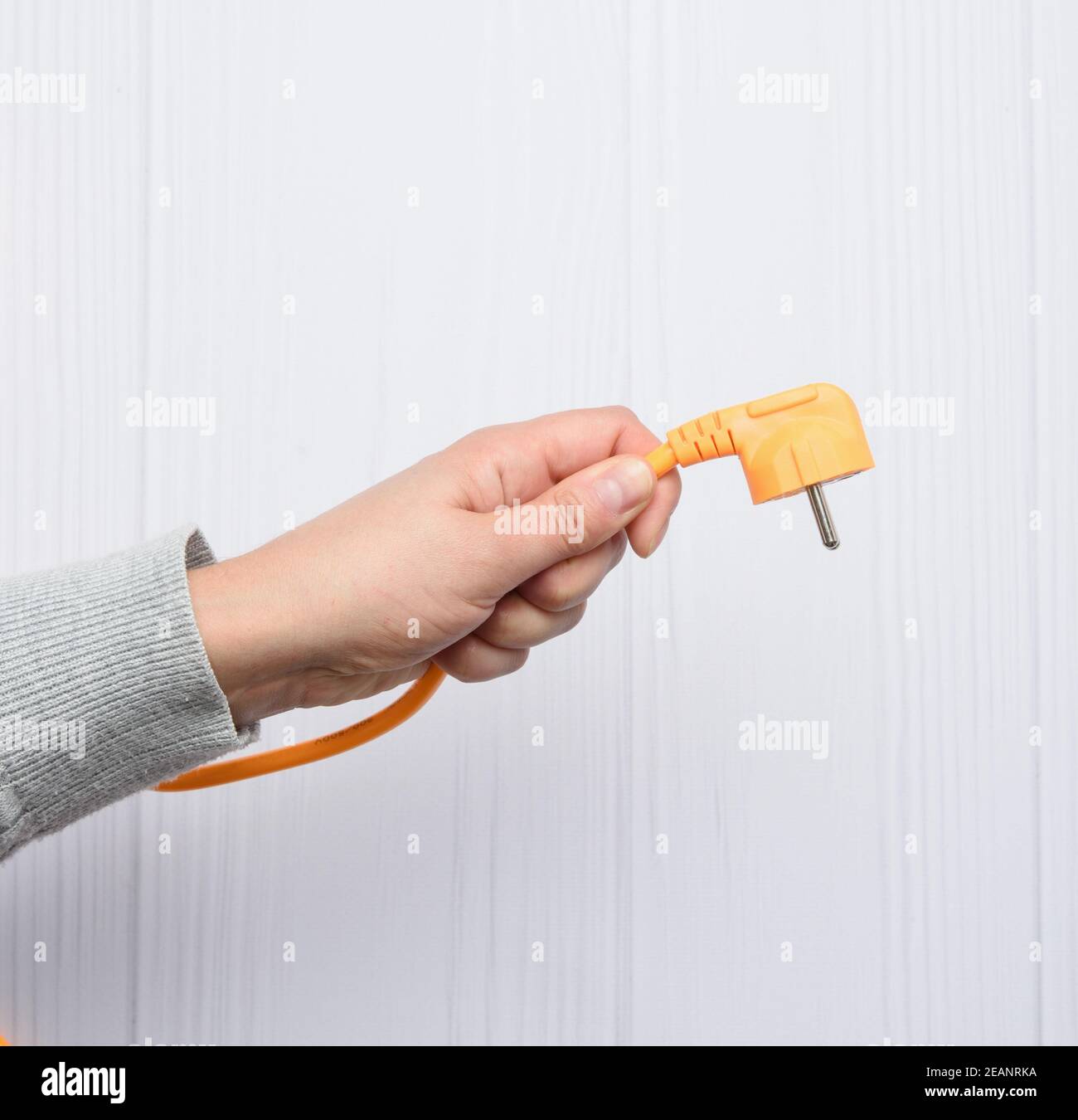 Handbuchsen für orangefarbenes Kabel mit Stecker für Buchse Stockfoto