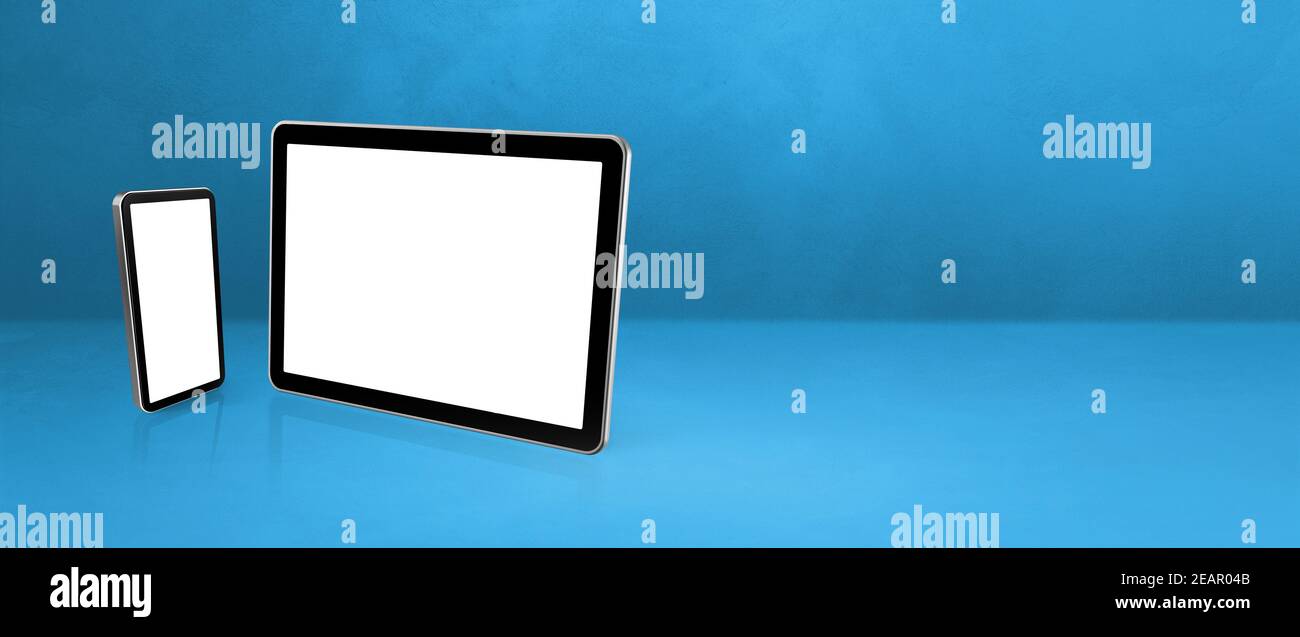 Mobiltelefon und digitaler Tablet-pc auf blauem Büroschreibtisch. Hintergrund-Banner Stockfoto