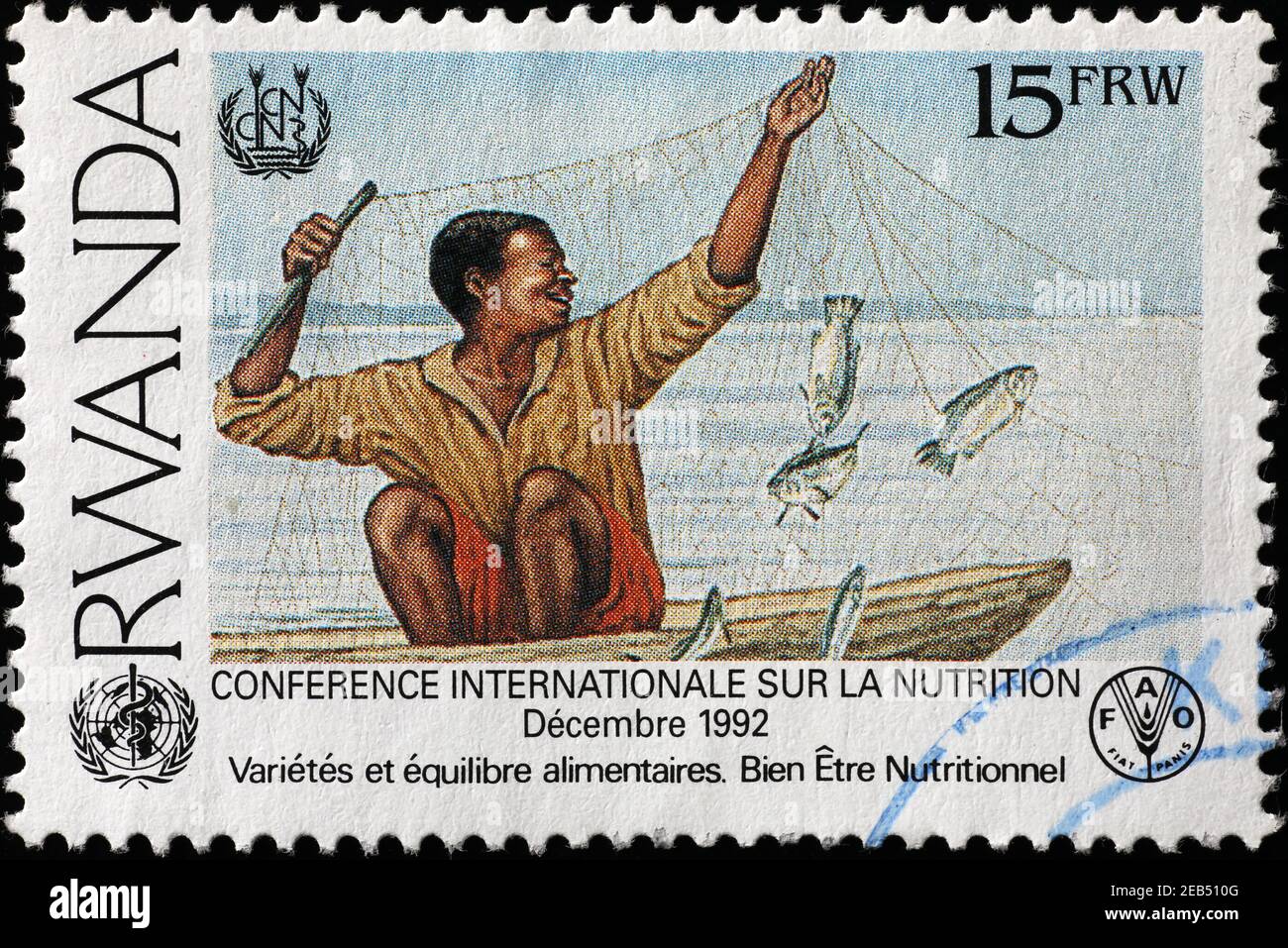 Afrikanischer Fischer mit Netz auf Briefmarke von Ruanda Stockfoto
