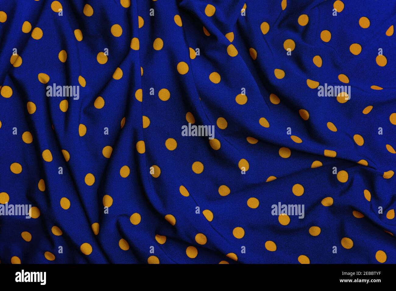 Polka Punkt blau und gelb Stoff Hintergrund Stockfoto