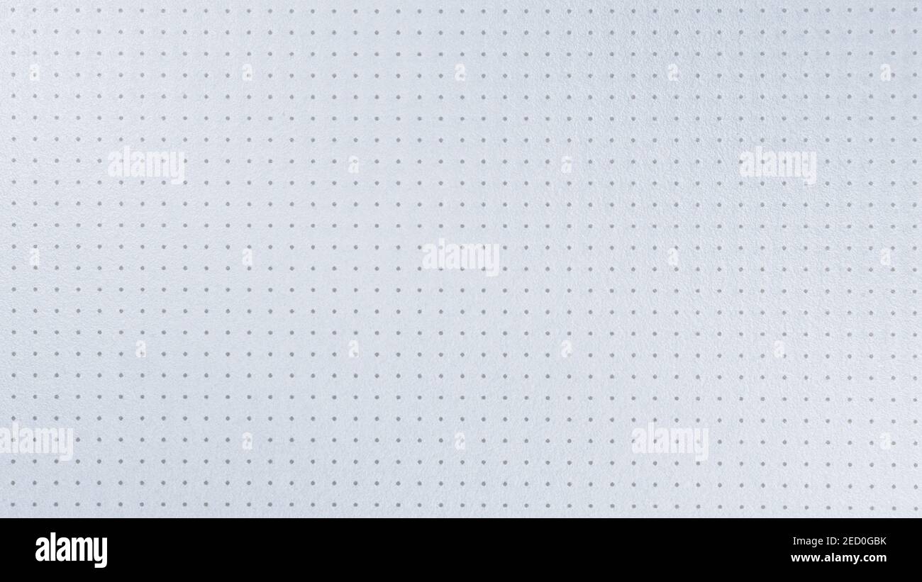 Weiße gepunktete Kunststoffoberfläche aus der Nähe. Textur und Hintergrund Stockfoto
