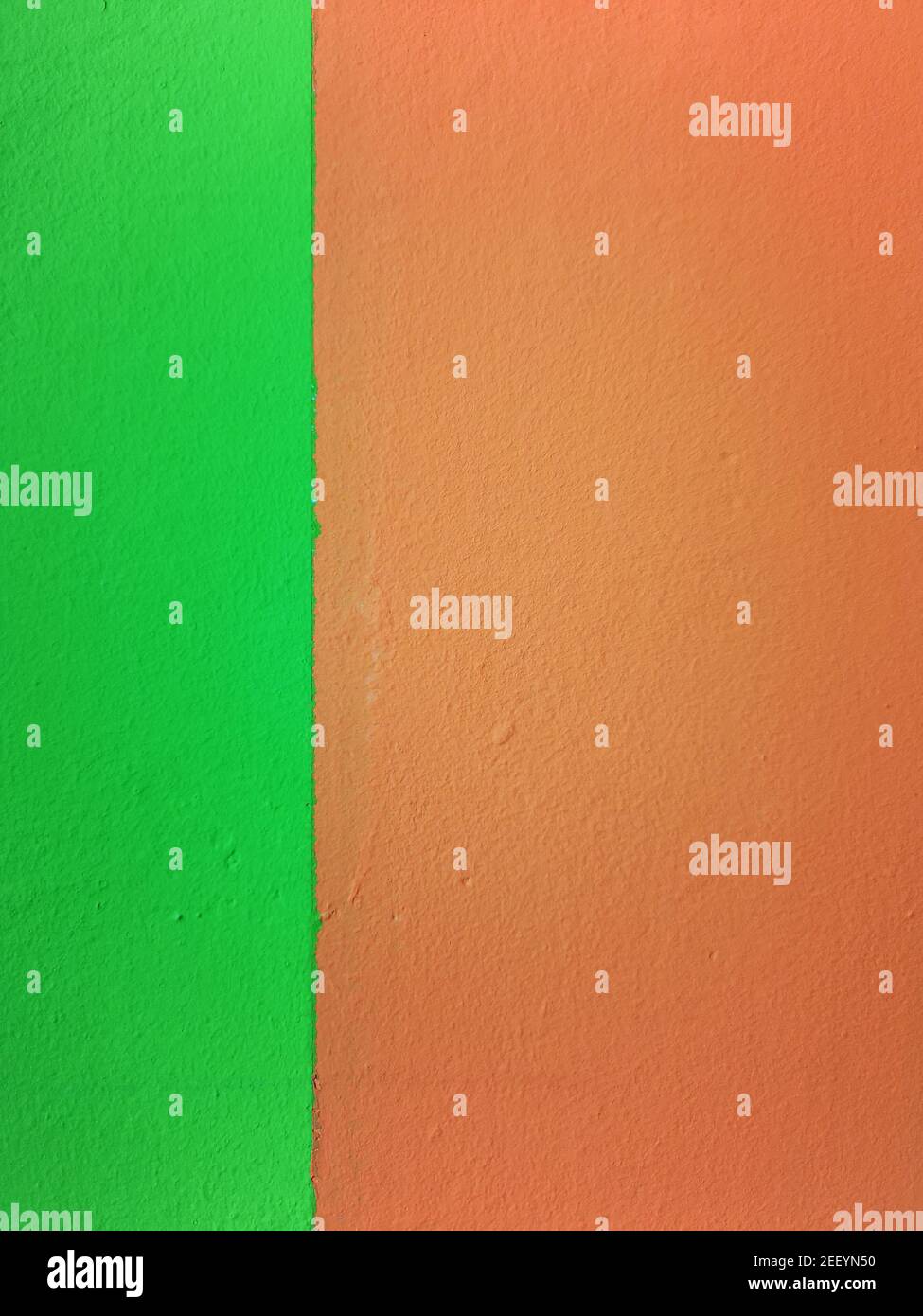 Orange tutti frutti und Tweed grüne Wand Hintergrund Textur Stockfoto