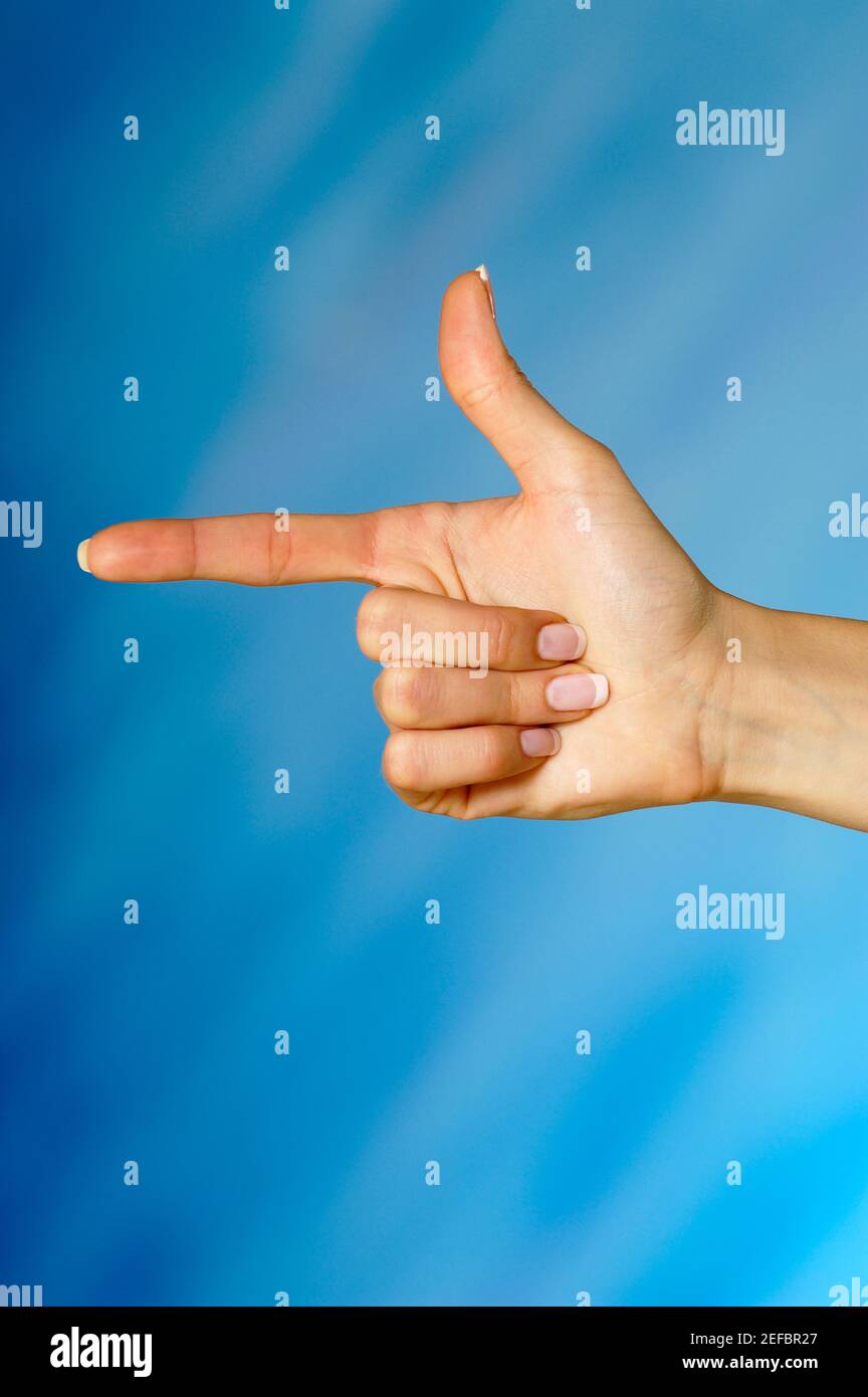 Nahaufnahme einer womanÅ½s Hände, die auf einen Finger zeigen Stockfoto