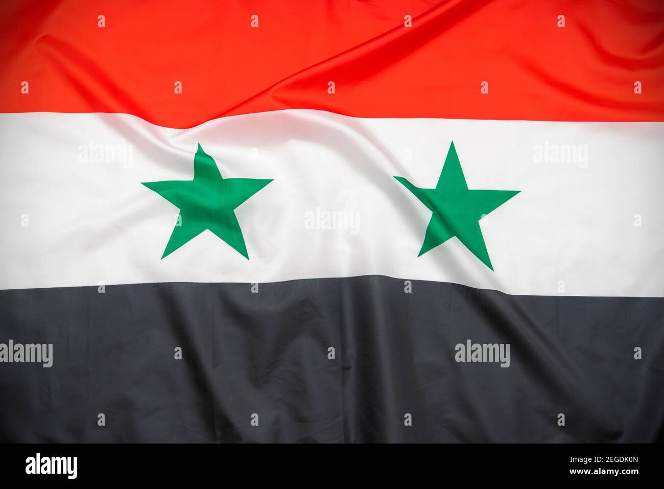 Fabric Nationalflagge von Syrien als Hintergrund Stockfoto