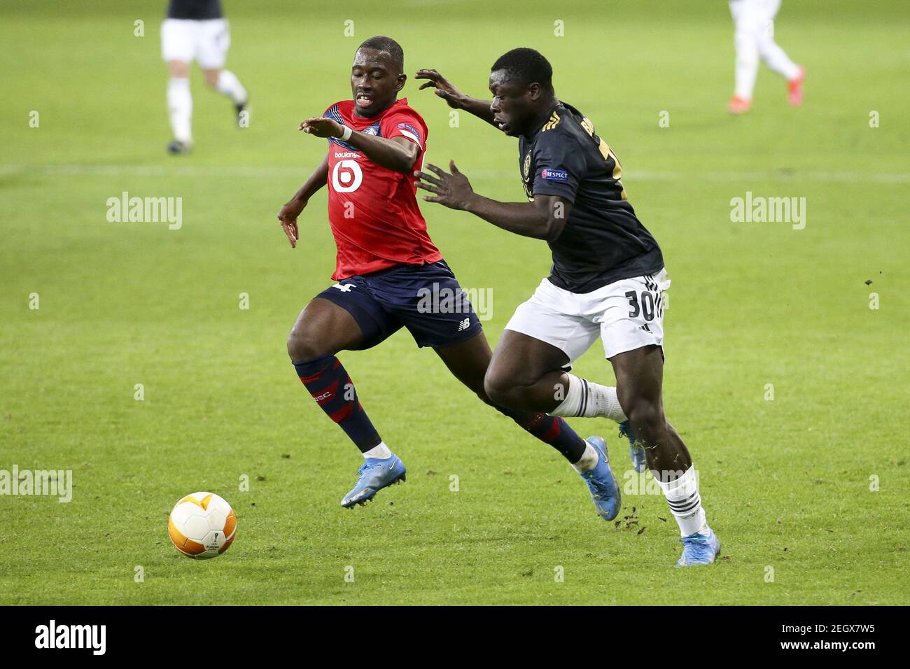 Brian Brobbey von Ajax, Boubakary Soumare von Lille (links) während der UEFA Europa League, Runde von 32, 1st-Bein-Fußballspiel zwischen / LM Stockfoto