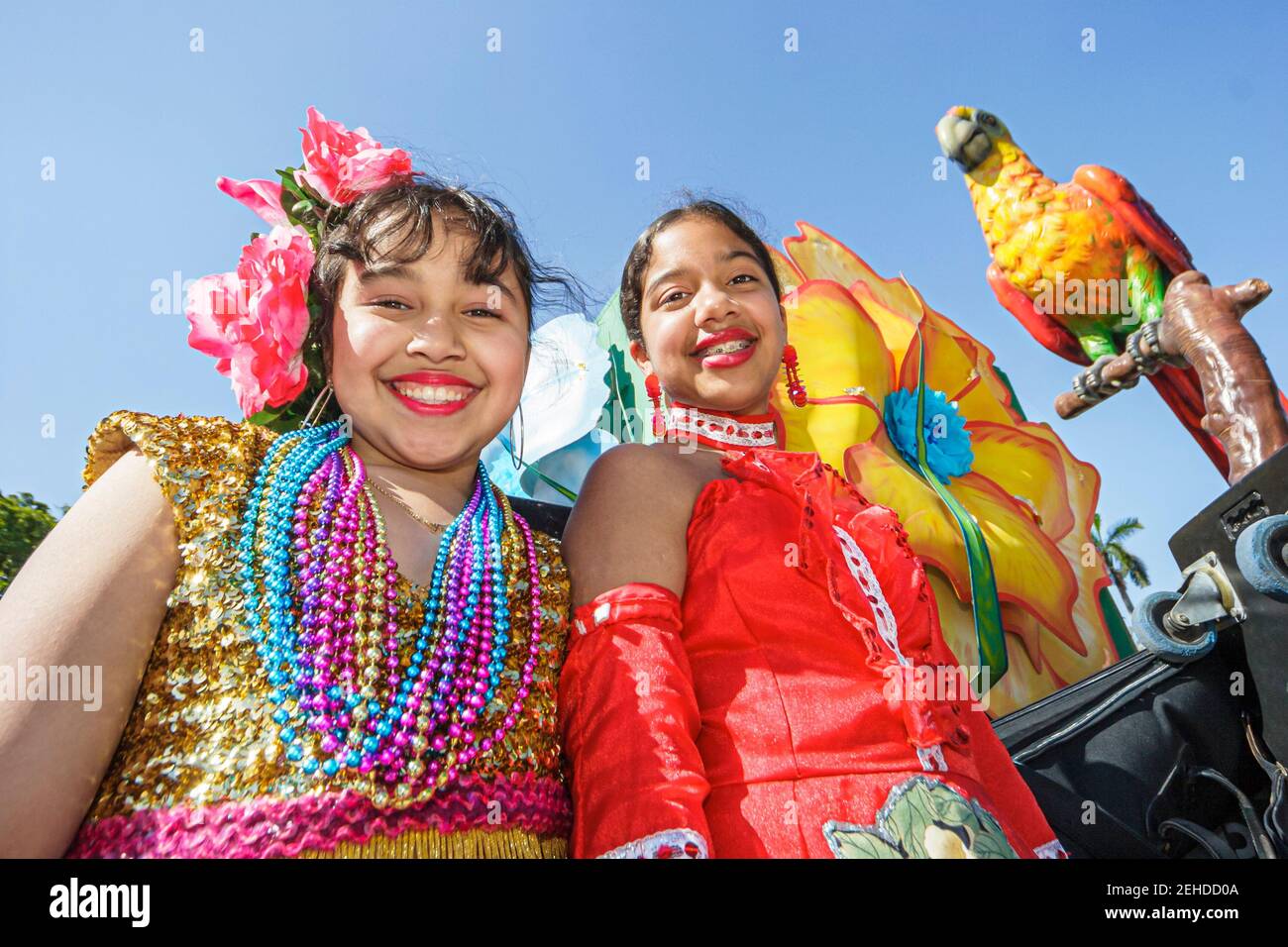 Miami Florida, Bayfront Park Greater Miami Mardi Gras Festival, Haitian Hispanic Caribbean girl girls friends wearing costumes Beads float, riding, Stockfoto