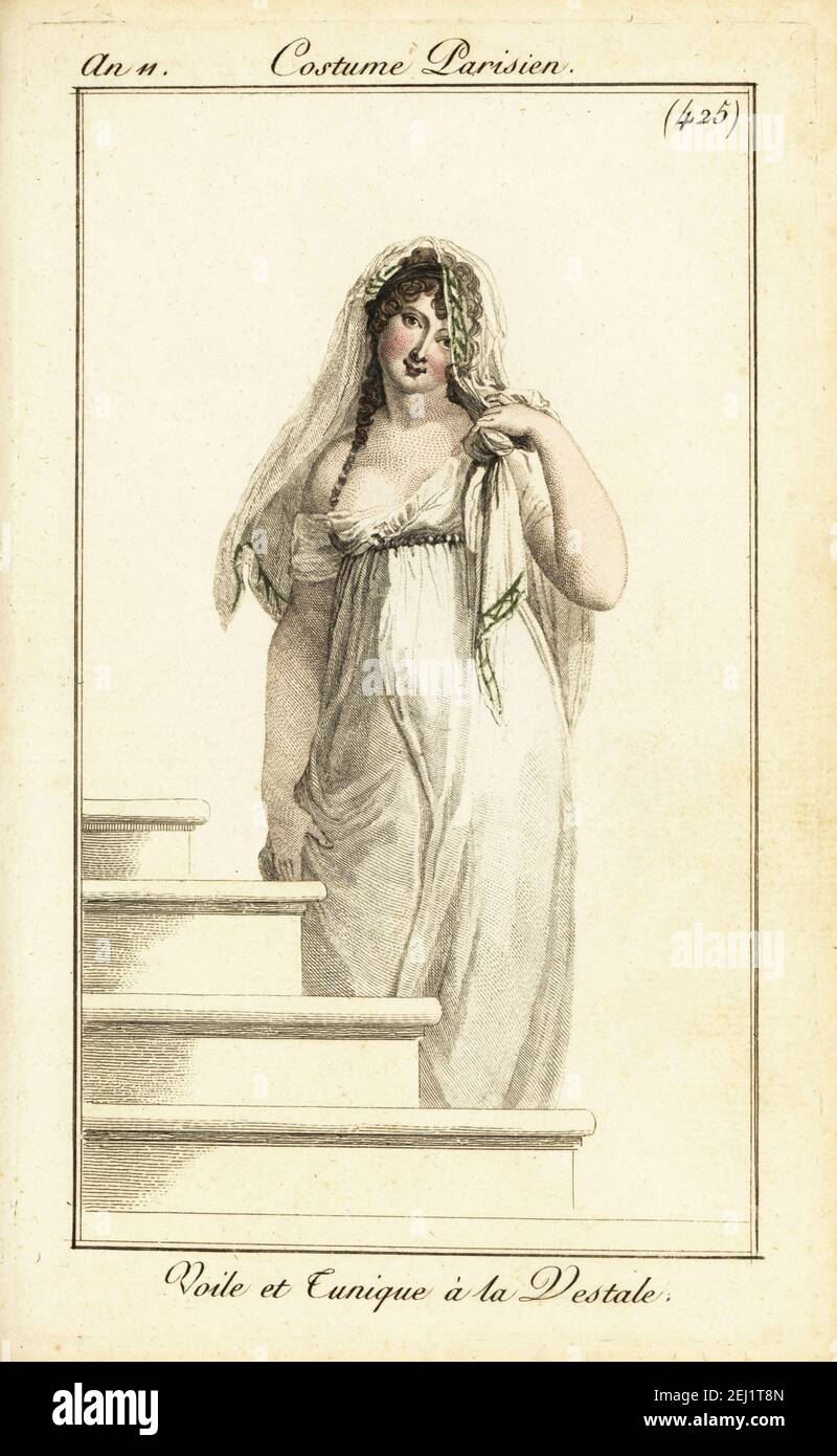 Merveilleuse im Schleier und Tunikakleid aus Spitze. Dieser frühe Empire-Stil wurde nach den Vestal Virgins benannt. Voile et Tunique à la Vestale. Handkolorierter Kupferstich aus Pierre de la Mesangeres Journal des Dames et des Modes, Magazine of Women and Fashion, Paris, an 11, November 1802. Illustrationen von Carle Vernet, Jean-Francois Bosio, Dominique Bosio und Philibert Louis Debucourt, gestochen von Pierre-Charles Baquoy. Stockfoto