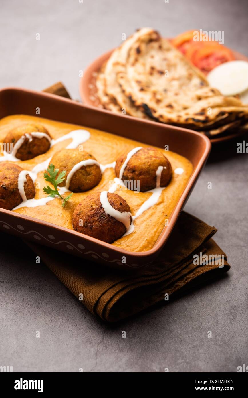 Malai Kofta Curry ist eine indische Küche Gericht mit Kartoffel-Hütte Käse gebratene Kugeln in Zwiebeltomate Soße mit Gewürzen Stockfoto