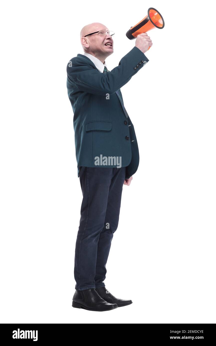 Irritierter Geschäftsmann im Gespräch durch ein Megaphon. In vollem Wachstum. Stockfoto
