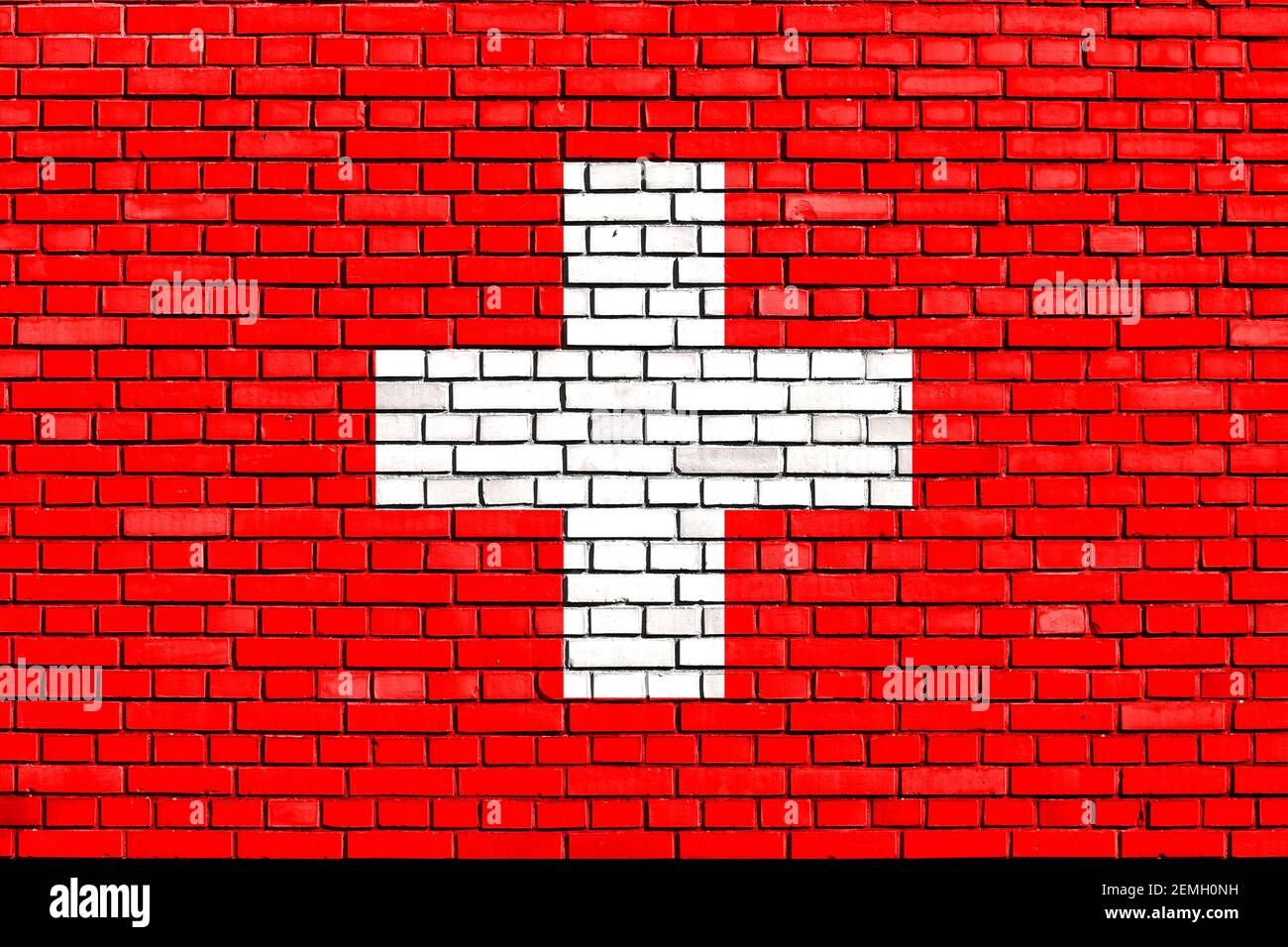 Flagge der Schweiz auf Ziegelmauer gemalt Stockfoto