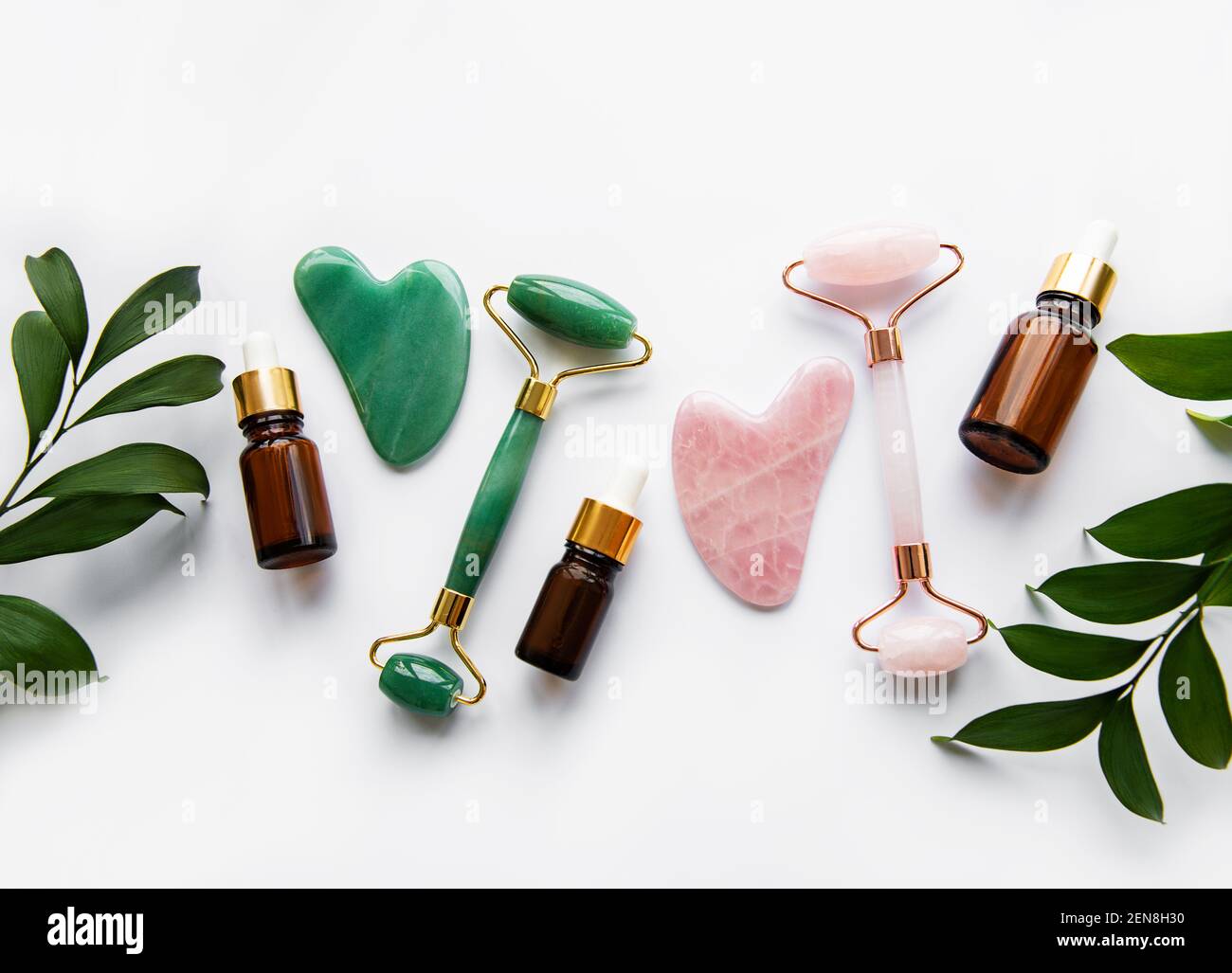 Face massage jade rollers on white background Stockfoto