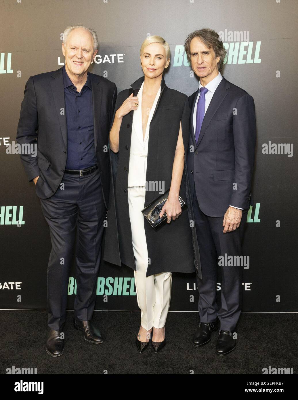 John Lillithgow, Charlize Theron in Kleid von Dior, Jay Roach nehmen am 16. Dezember 2019 an der Bombshell-Sondervorführung im Jazz im Lincoln Center in New York, NY, Teil. (Foto von Lev Radin/Pacific Press/Sipa USA) Stockfoto