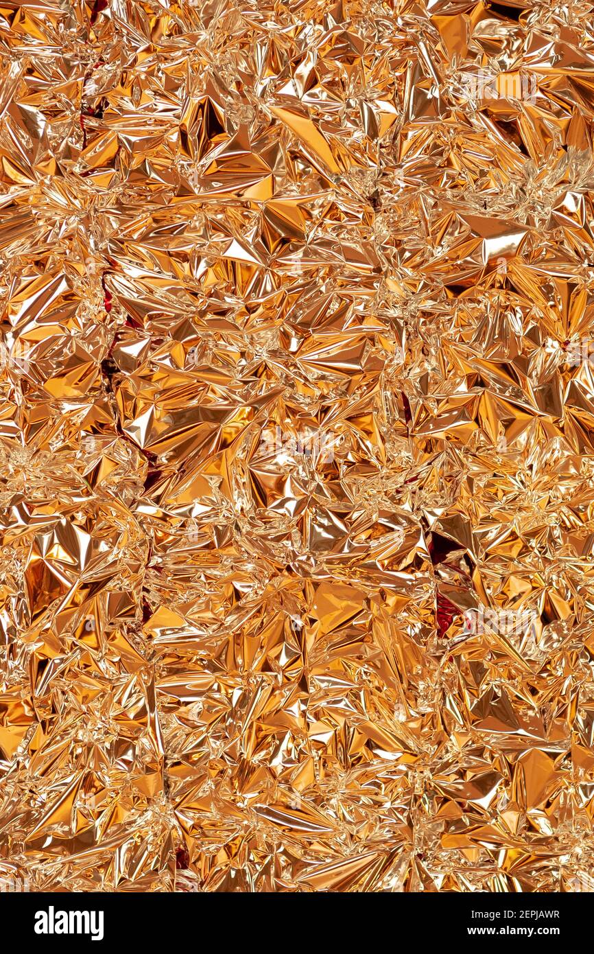 goldene glänzende Folie Textur Muster. Vorlage für Dekor und Design Stockfoto
