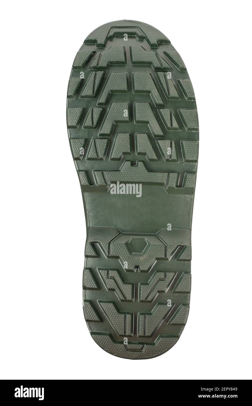 Die Sohle der Gummistiefel ist grün. Leistungsstarker Schuhschutz. Datei enthält Beschneidungspfad. Stockfoto