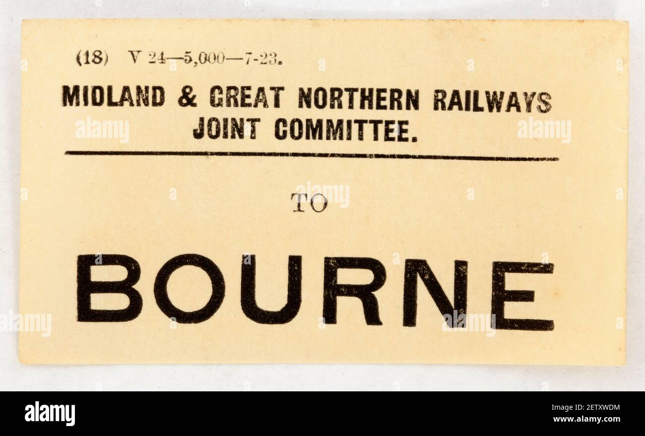 Alte Eisenbahn bedrucktes Papier Gepäcketikett zu Bourne Stockfoto