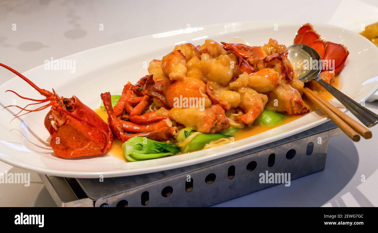 Ein köstliches chinesisches kantonesisches Gericht, gebackene Hummerwürfel mit Käse Stockfoto