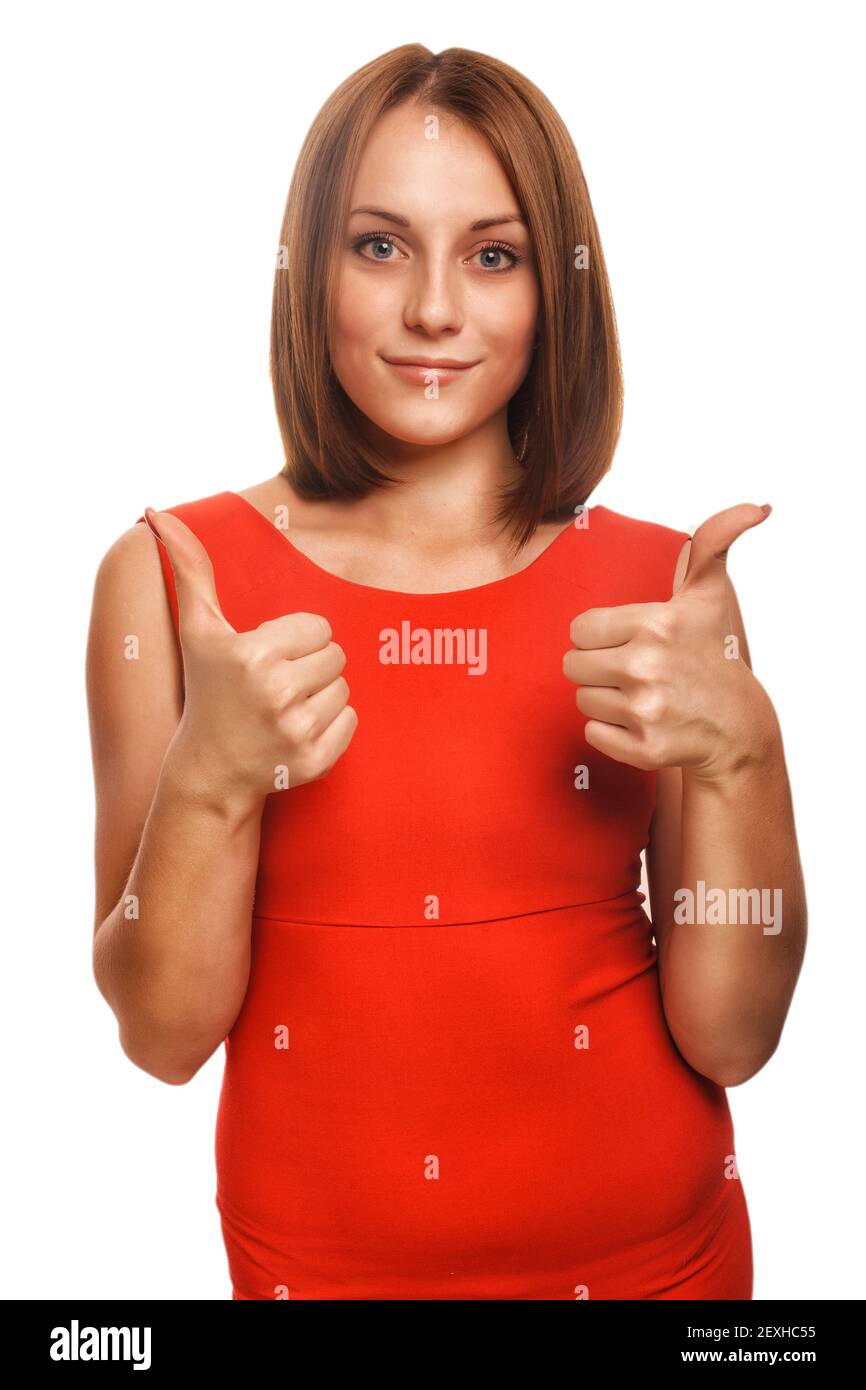 Mädchen Frau junge positive Zeichen Daumen ja in roten Kleid Isoliert Stockfoto
