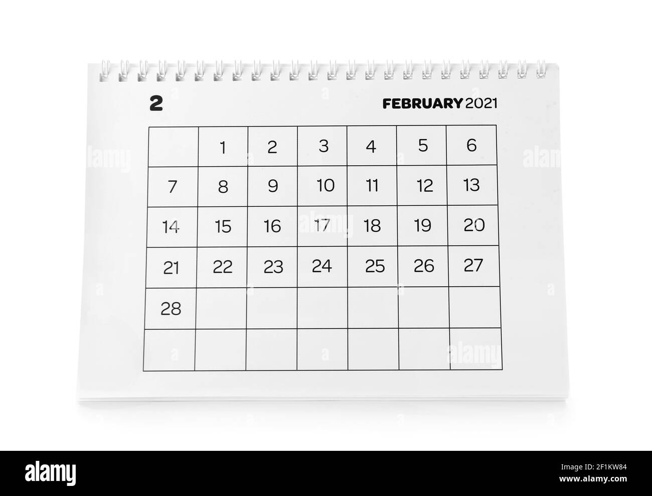 Papierkalender auf weißem Hintergrund drehen Stockfoto