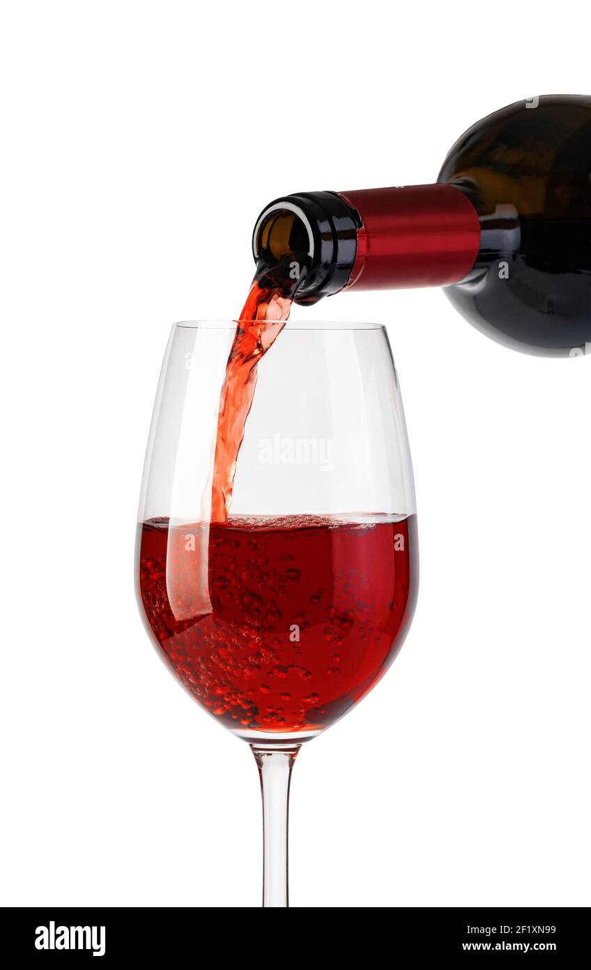 Rotwein in Glas gießen Stockfoto