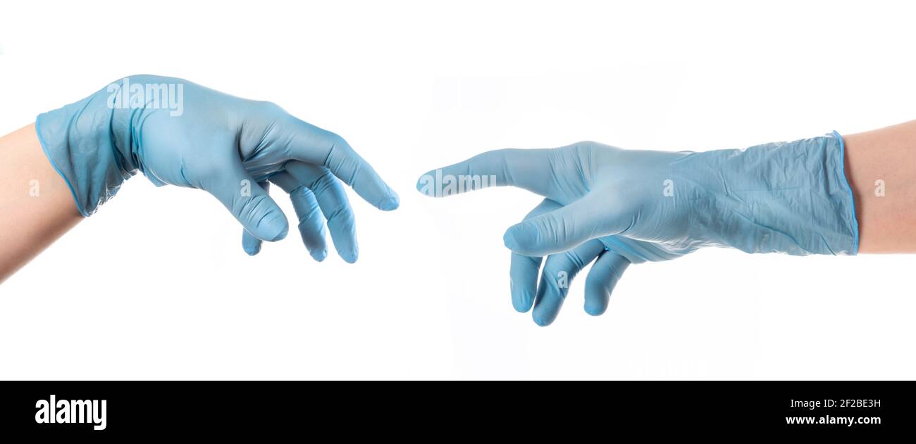 Hände mit blauem Handschuh nach Michelangelos Gemälde von Gott erschafft den Menschen die Schöpfung Adams Stockfoto