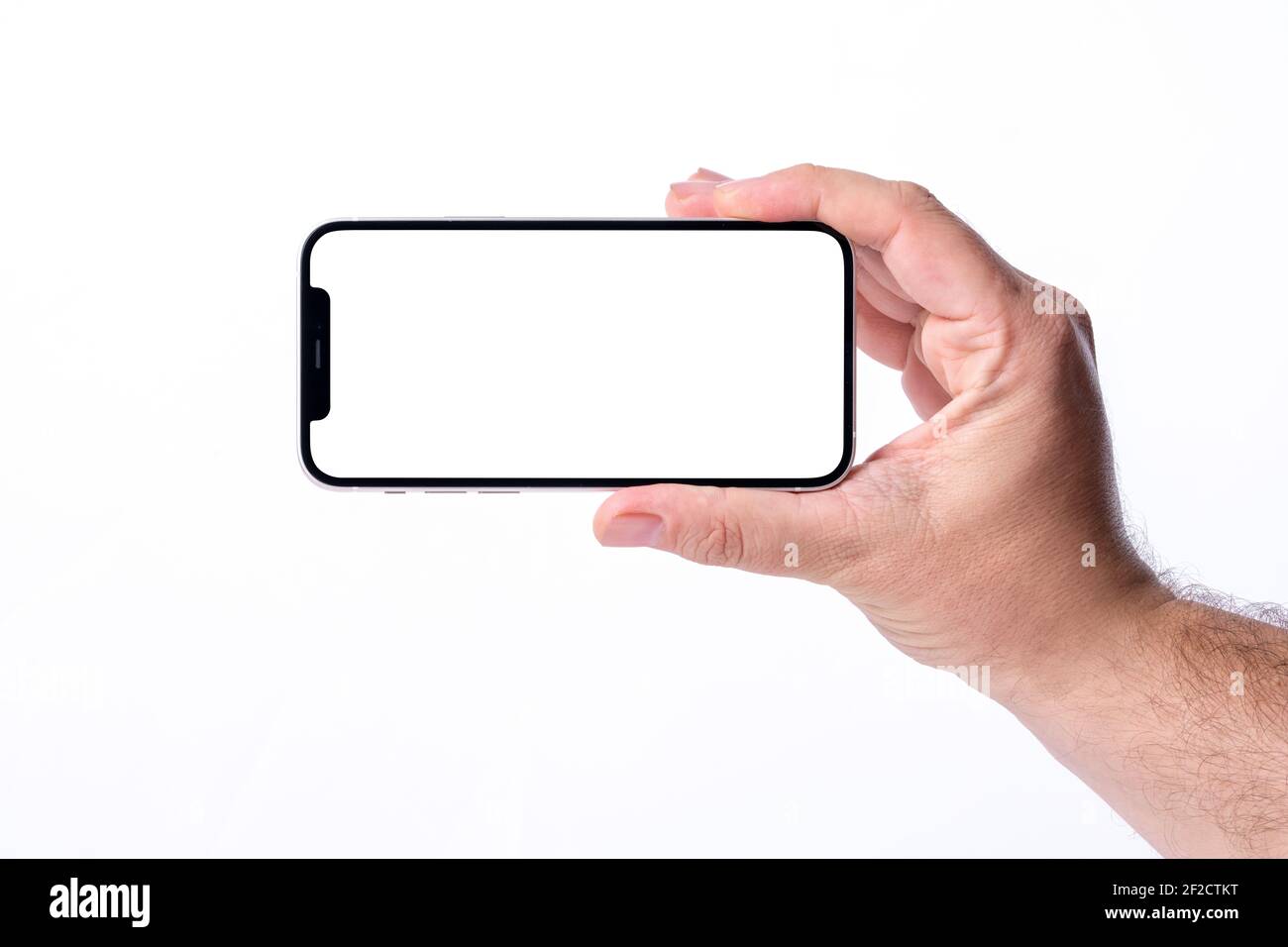 Antalya, Türkei - 07. März 2021: Hand hält schwarzes Smartphone iPhone 12 mit weißem Bildschirm. Isoliert auf weißem Hintergrund. Rahmenlose Handynummer Stockfoto