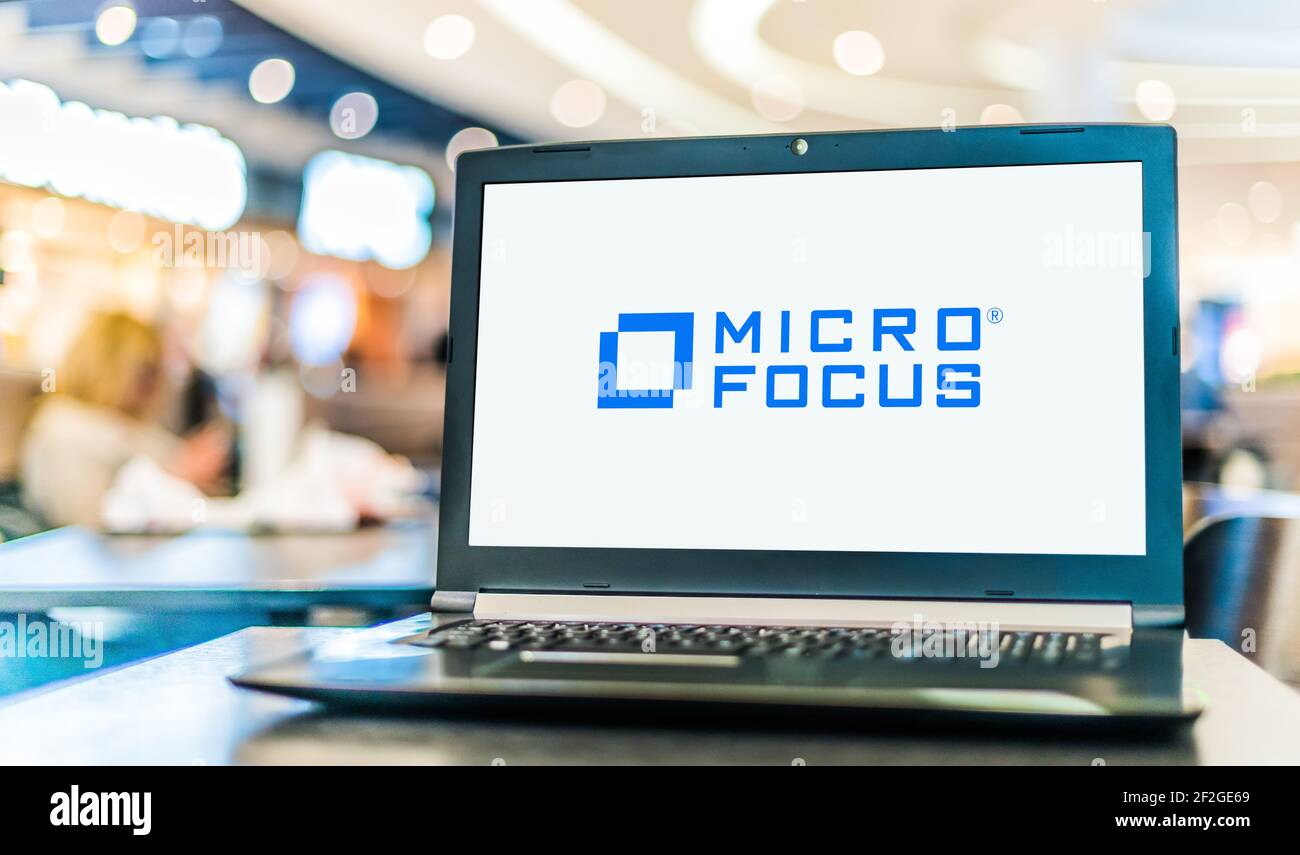 POZNAN, POL - 6. FEB 2021: Laptop-Computer mit Logo von Micro Focus International, einem britischen Software- und IT-Unternehmen Stockfoto