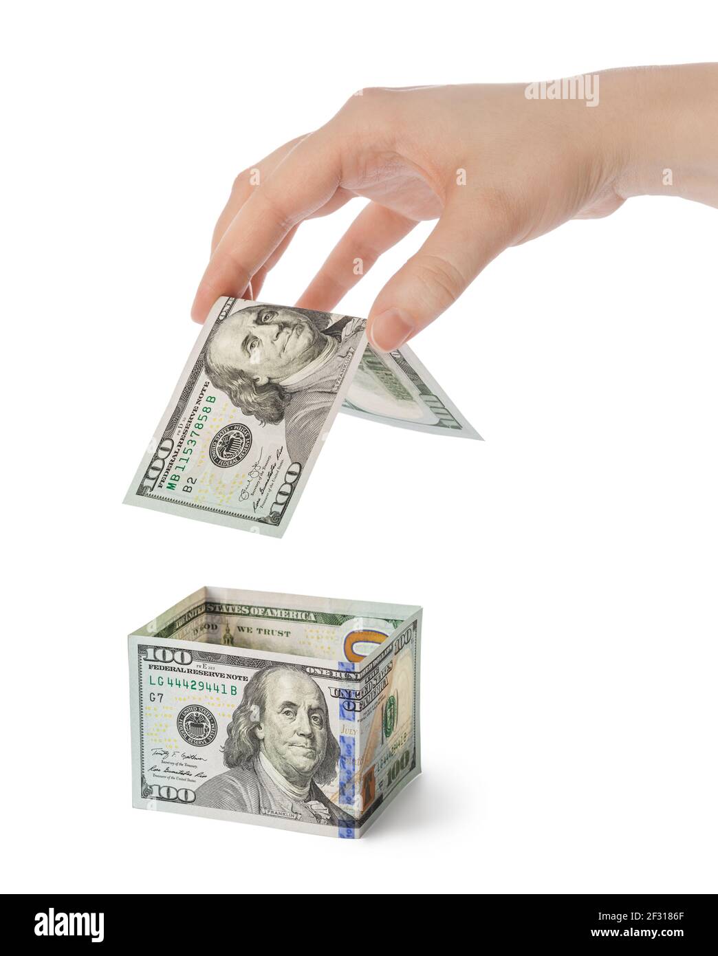 Hände und Geld Haus Stockfoto