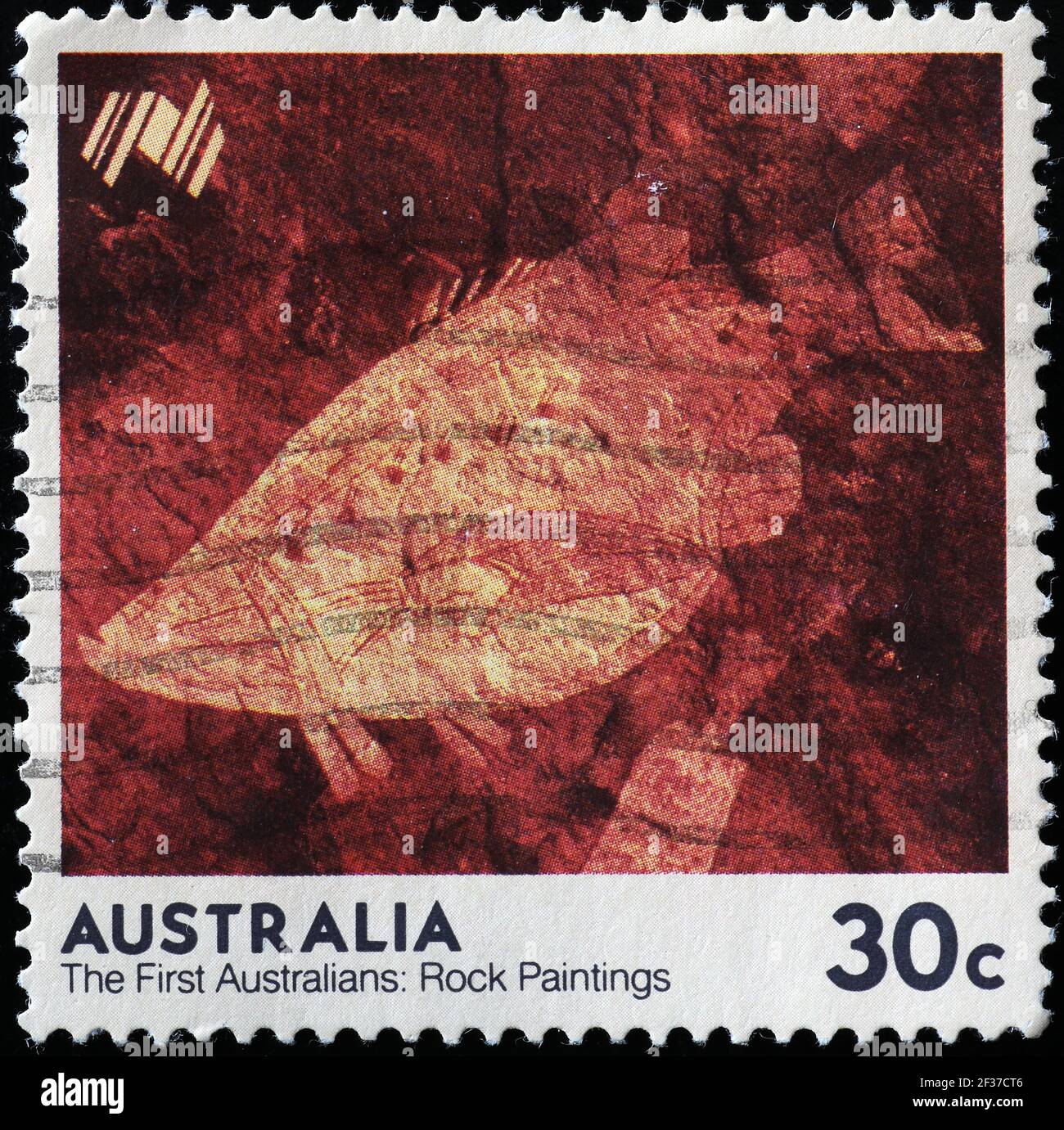 Felsbild eines Fisches der Aborigines auf australischer Marke Stockfoto