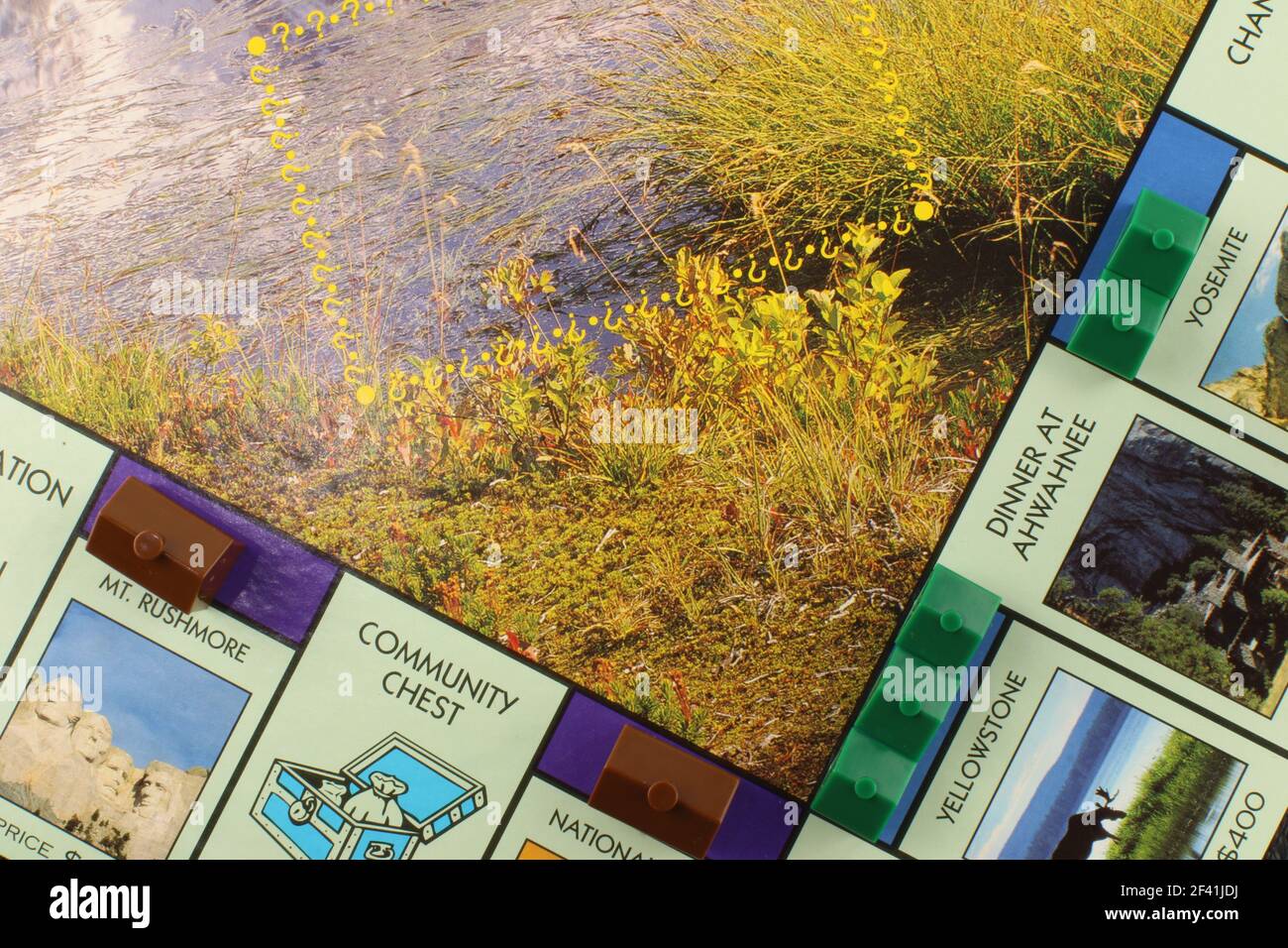 Häuser auf einem Teil der USA Nationalparks Monopolboard. USA Home Ownership Konzept Stockfoto