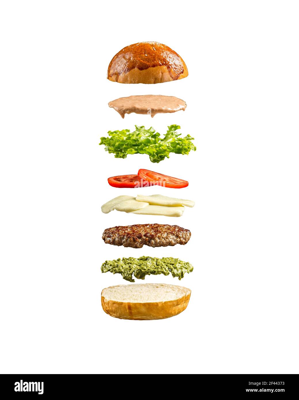 Isolierte schwimmende Burger Zutaten auf dem weißen Stockfoto