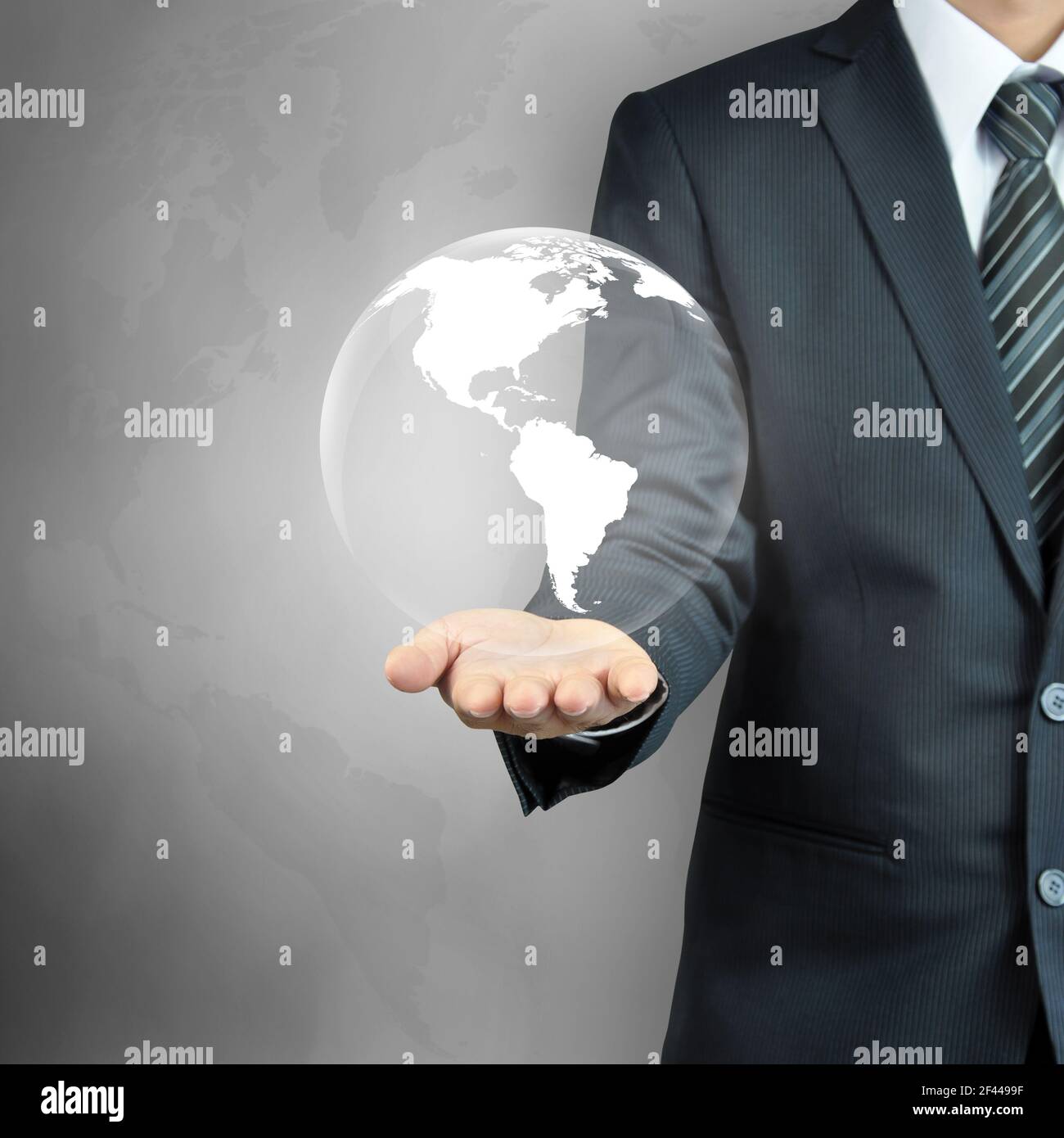Geschäftsmann Hand trägt den Globus - Erfolg im Geschäft, Weltherrschaft Konzept etc. Stockfoto