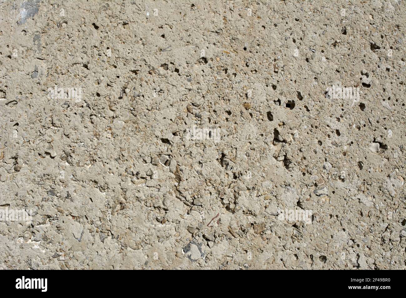 Eine Nahaufnahme einer strukturierten rauen Steinoberfläche Stockfoto