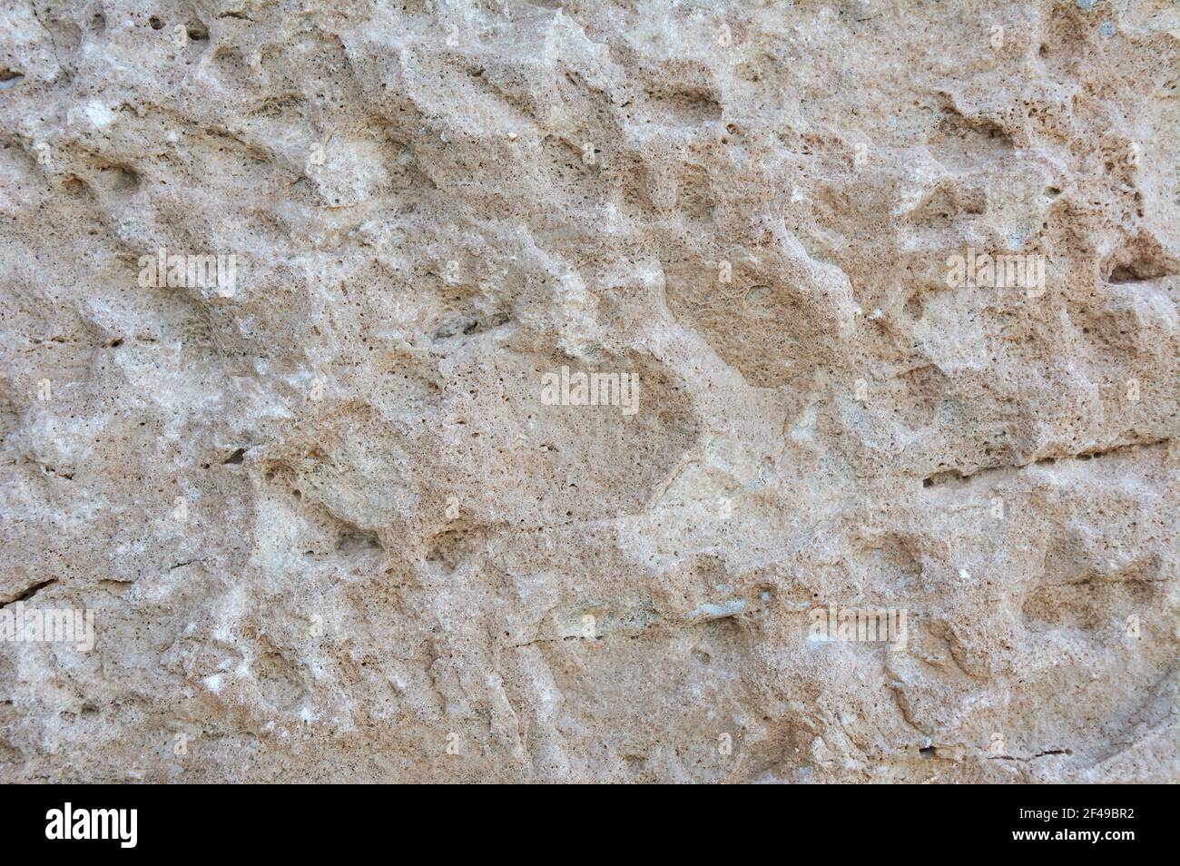 Eine Nahaufnahme einer strukturierten rauen Steinoberfläche Stockfoto