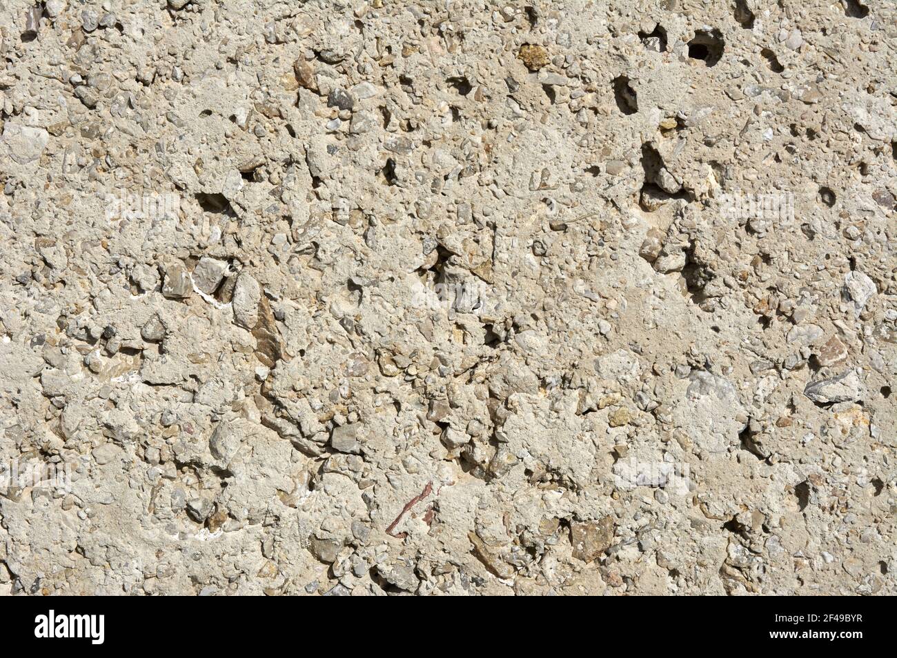 Eine Nahaufnahme einer strukturierten rauen Steinoberfläche Stockfoto