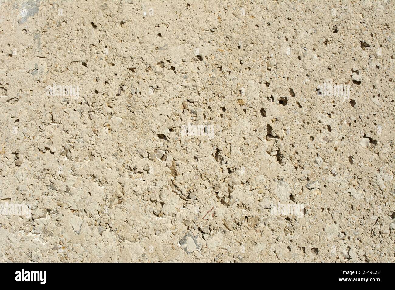 Eine Nahaufnahme einer strukturierten rauen Steinoberfläche Stockfoto
