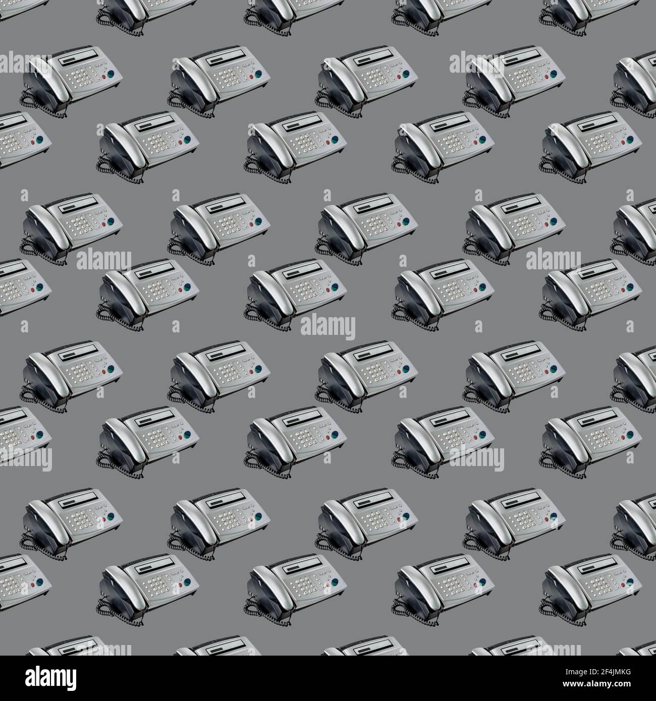 Altes Büro-Faxgerät auf grauem Hintergrund. Nahtloses Muster mit Fax. Büroausstattung, Telefon und Fax Stockfoto